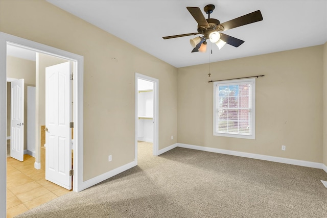 empty room featuring light carpet and ceiling fan