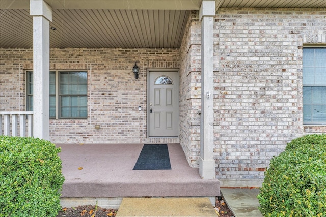 doorway to property featuring covered porch