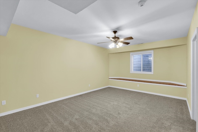 empty room featuring carpet floors and ceiling fan