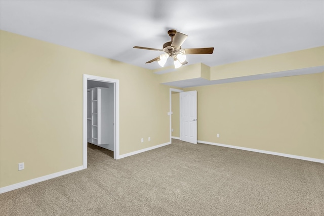 spare room with ceiling fan and carpet floors