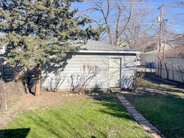 view of outbuilding with a yard