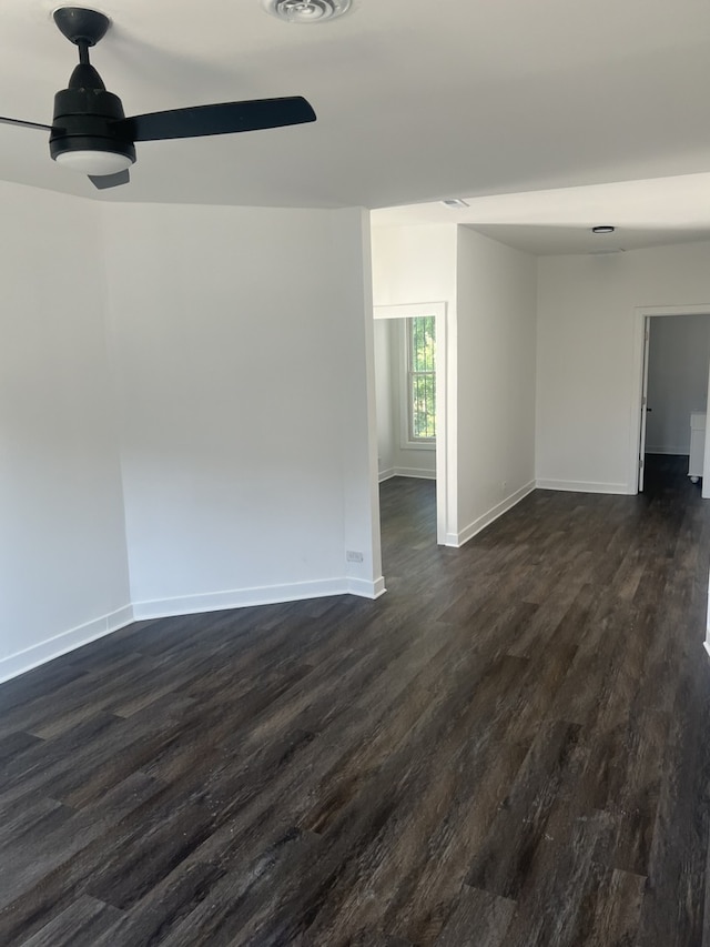 empty room featuring dark wood-type flooring