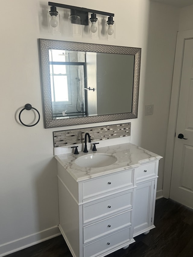 bathroom featuring vanity and hardwood / wood-style flooring