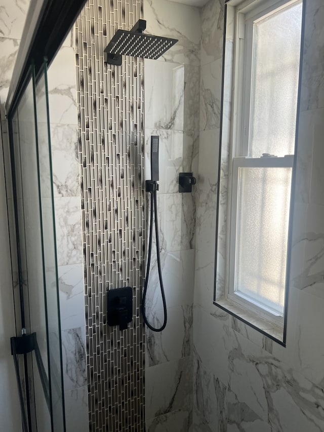 interior space with a tile shower