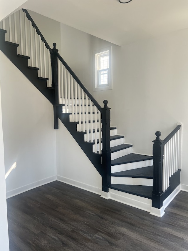 staircase with wood-type flooring