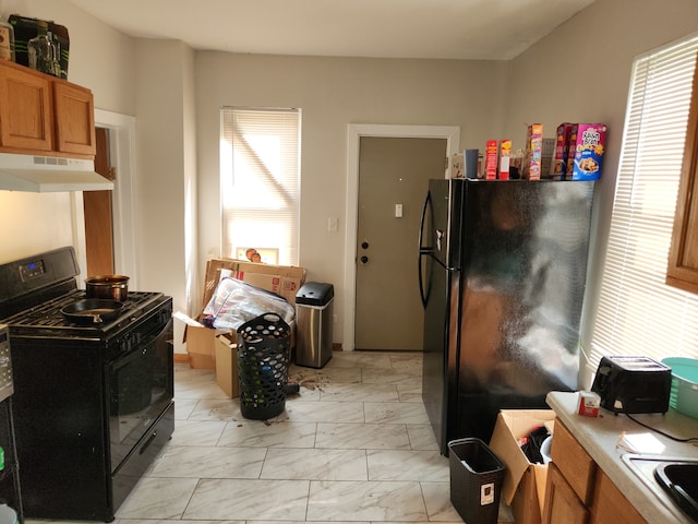 kitchen featuring black appliances and sink