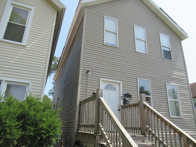 back of property featuring a deck