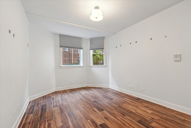 spare room with hardwood / wood-style flooring