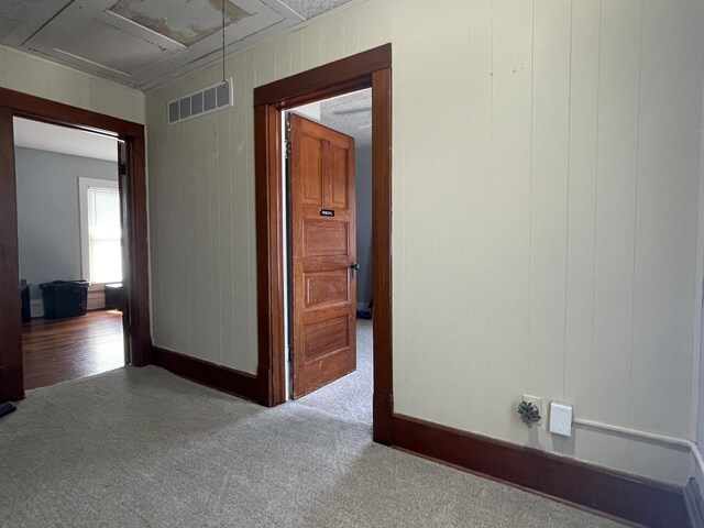 hallway featuring carpet flooring