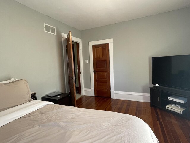 bedroom featuring dark wood-type flooring