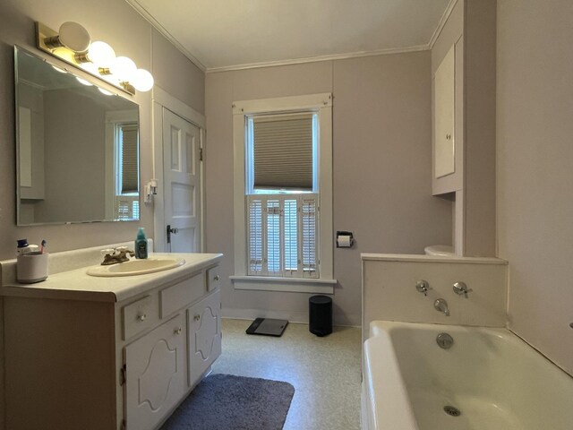 bathroom featuring toilet, crown molding, a tub to relax in, and vanity