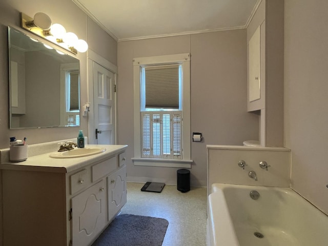 bathroom featuring a garden tub, crown molding, vanity, and tile patterned floors