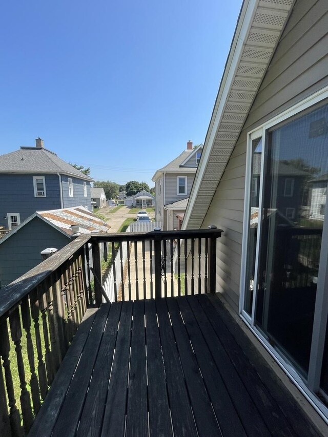 wooden terrace with a residential view