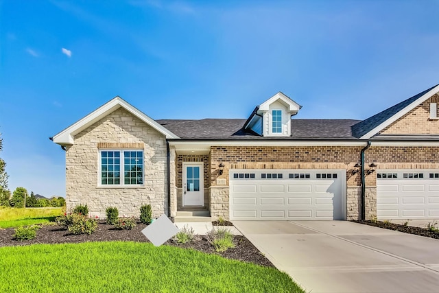 view of front of house with a garage and a front yard