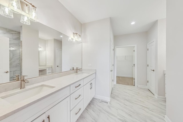 bathroom with tile patterned floors, vanity, and a shower with shower door