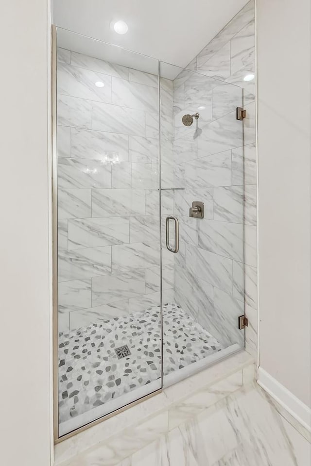 bathroom with tile patterned floors and an enclosed shower