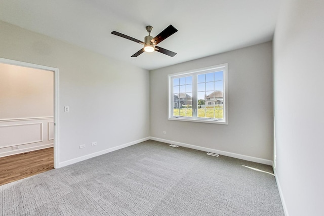 unfurnished room with carpet floors and ceiling fan