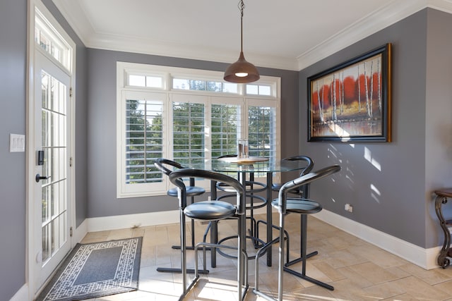 dining area featuring crown molding