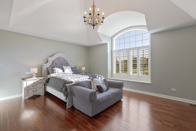 bedroom featuring dark hardwood / wood-style flooring and a notable chandelier