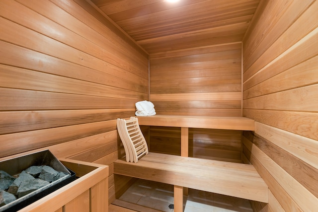 view of sauna with wood walls and wood ceiling