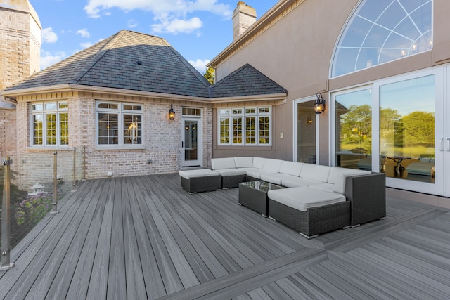 wooden terrace featuring outdoor lounge area