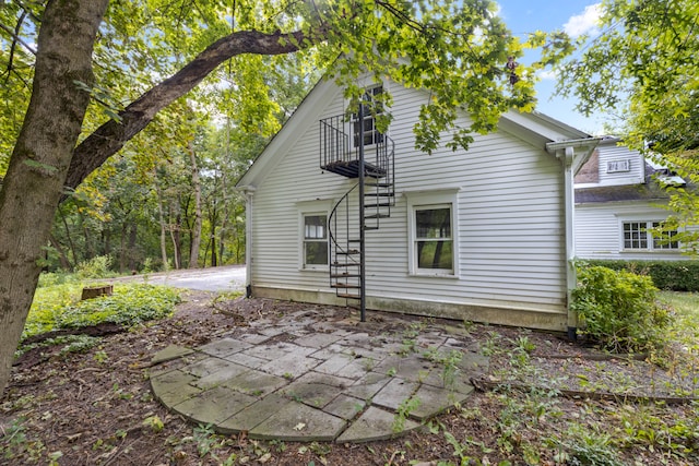 back of property with a patio