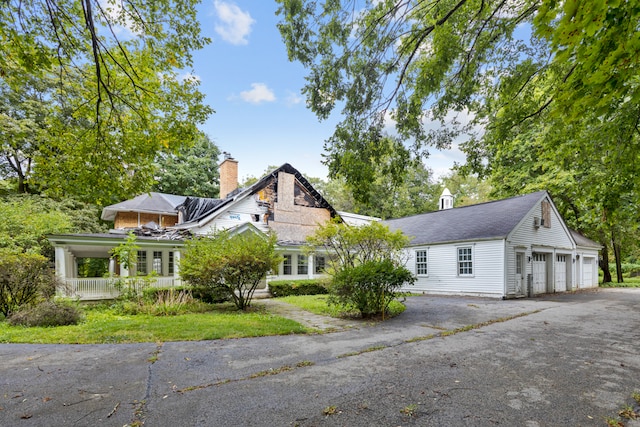 view of front facade with a front yard and a garage