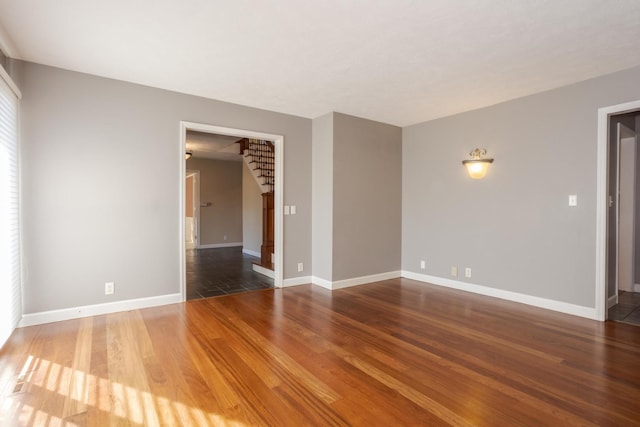 empty room featuring dark hardwood / wood-style flooring