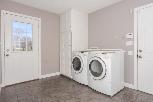 washroom with tile patterned floors, cabinets, and independent washer and dryer