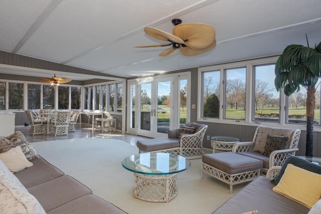 sunroom / solarium featuring ceiling fan, french doors, and vaulted ceiling