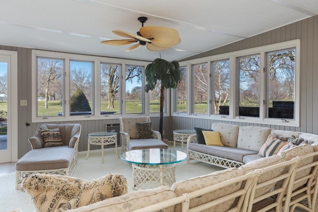 sunroom / solarium featuring ceiling fan and a healthy amount of sunlight