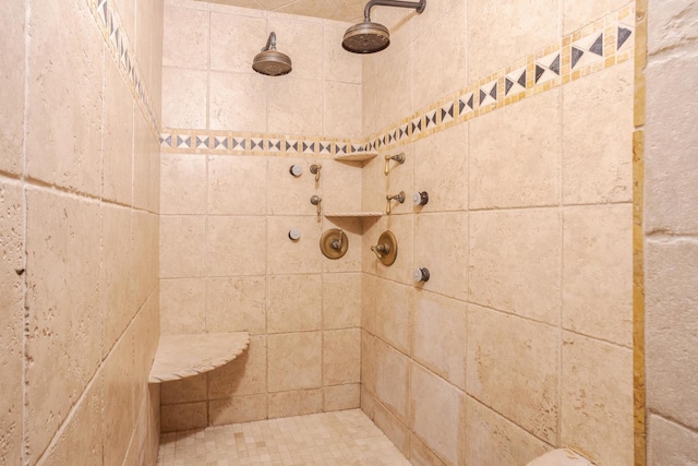 bathroom with a tile shower