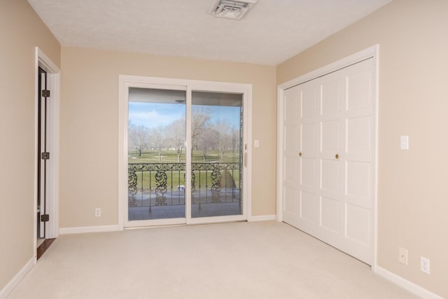 unfurnished bedroom with visible vents, baseboards, light carpet, a closet, and access to outside