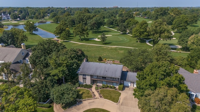 aerial view featuring golf course view and a water view