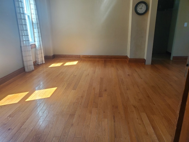 unfurnished room featuring light hardwood / wood-style floors