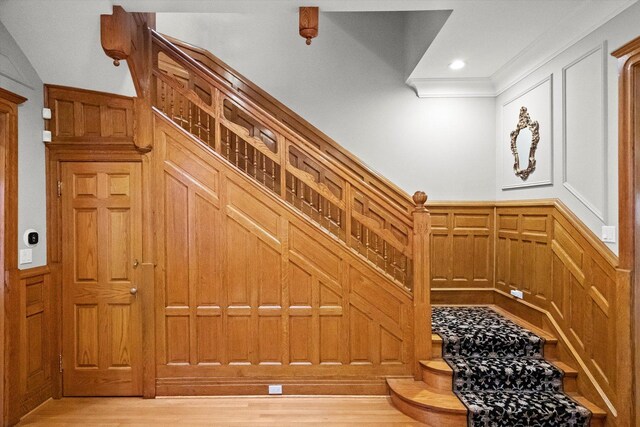 staircase with wood-type flooring