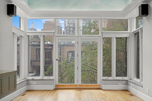 unfurnished sunroom featuring a healthy amount of sunlight