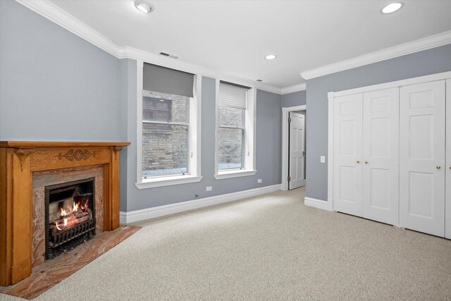 bedroom with carpet floors and crown molding