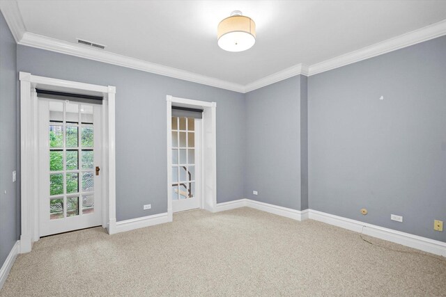 empty room with carpet flooring and ornamental molding