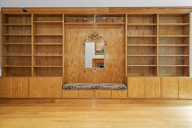 room details featuring hardwood / wood-style flooring and wood walls