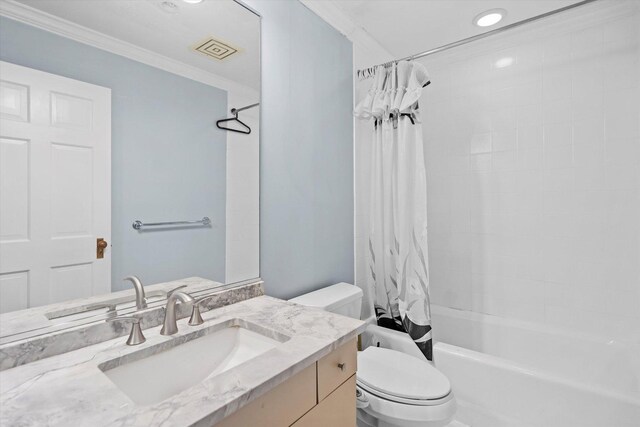 full bathroom featuring crown molding, vanity, shower / bath combo, and toilet