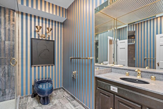 bathroom with tile patterned flooring, a shower with door, toilet, and vanity