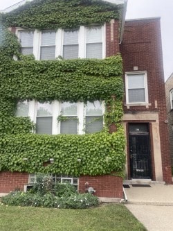 exterior space featuring brick siding