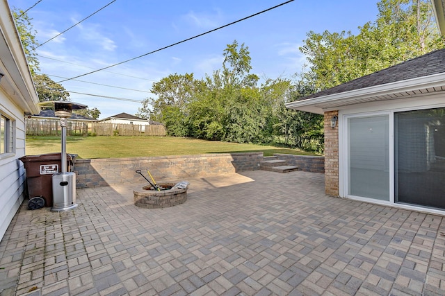 view of patio / terrace featuring an outdoor fire pit