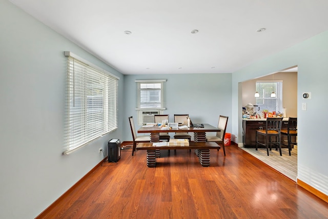 dining area with hardwood / wood-style floors