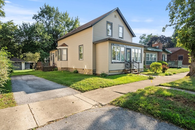 view of property exterior featuring a yard and an outdoor structure