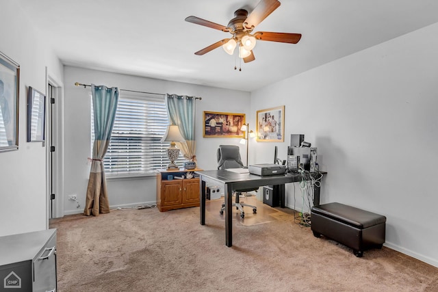 carpeted office featuring ceiling fan