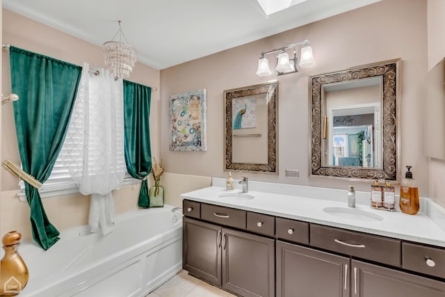 bathroom featuring vanity, a bathtub, and tile patterned floors