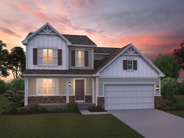 craftsman house with a garage and a lawn