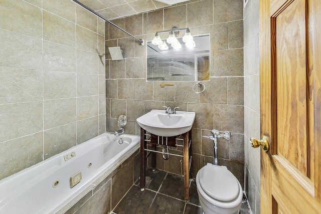full bath featuring tile walls, toilet, a sink, a combined bath / shower with jetted tub, and tile patterned flooring